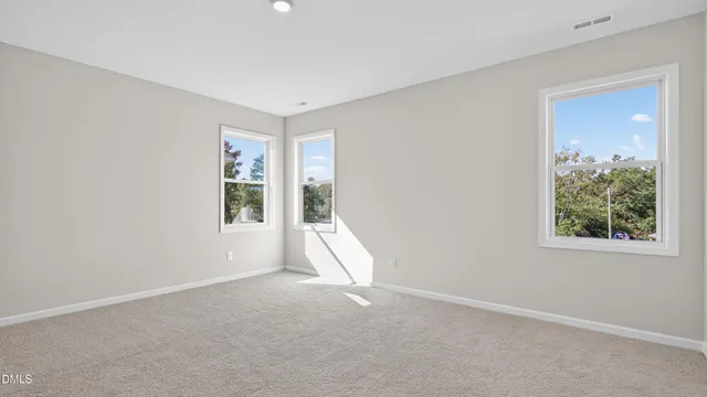 a bathroom with double sink and a mirror