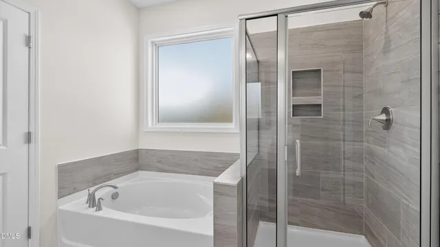 a view of a house with a big yard and large trees