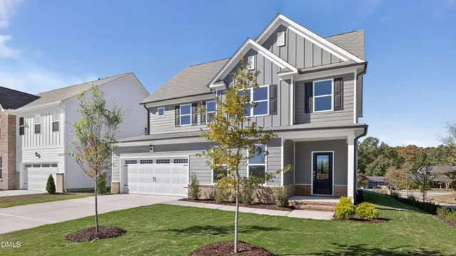 a view of a house with a yard and plants
