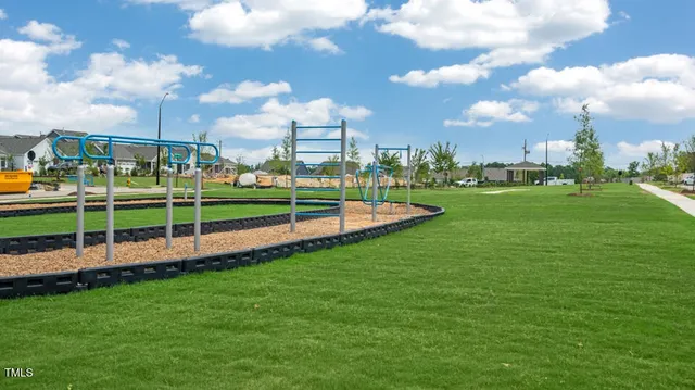 a view of a two chairs with wooden fence