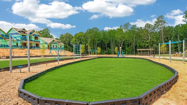 an aerial view of a house with outdoor space