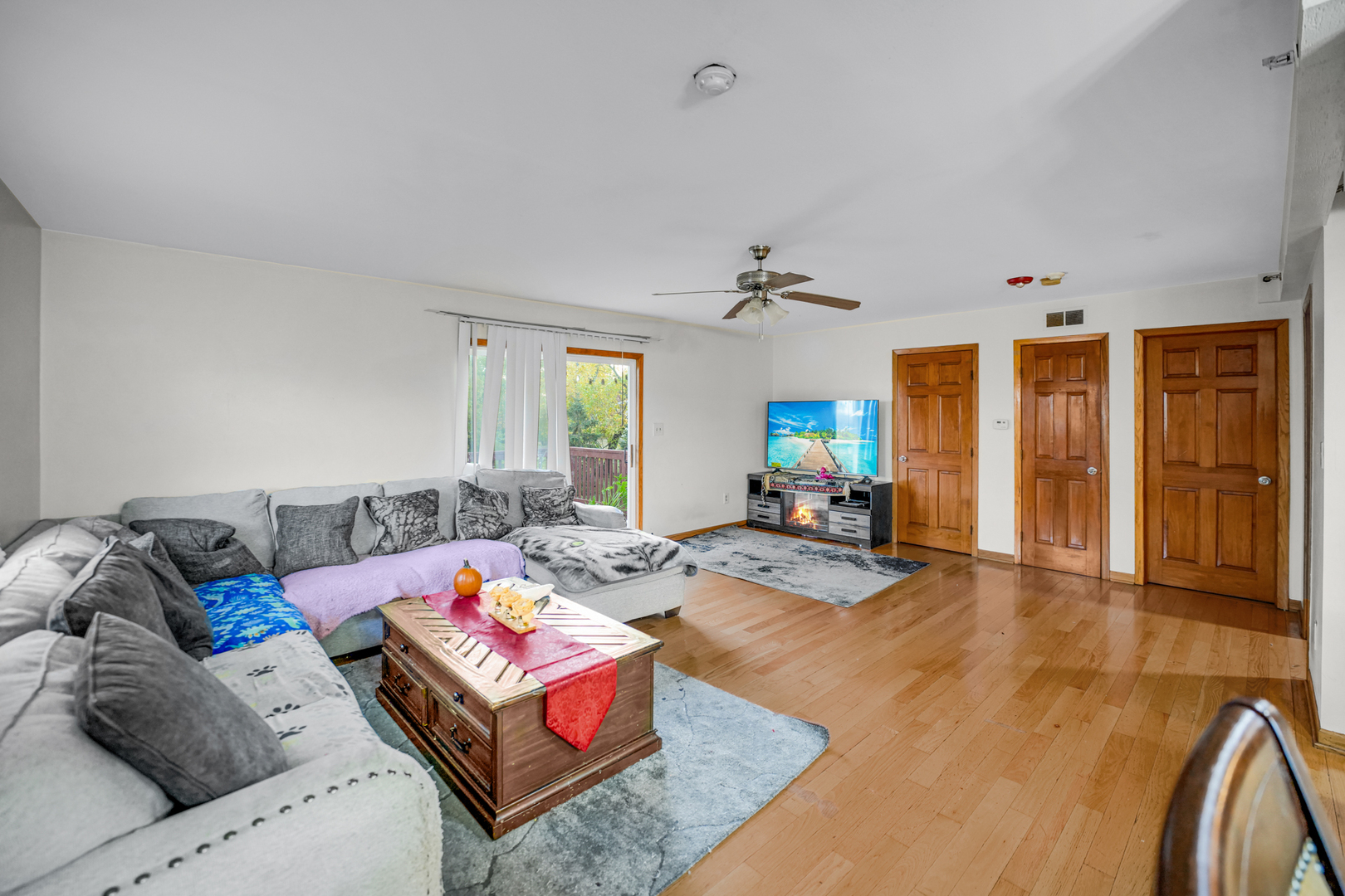 8845 West 75th Street Justice, IL 60458 - Photo 8 of 14 a living room with furniture and wooden floor