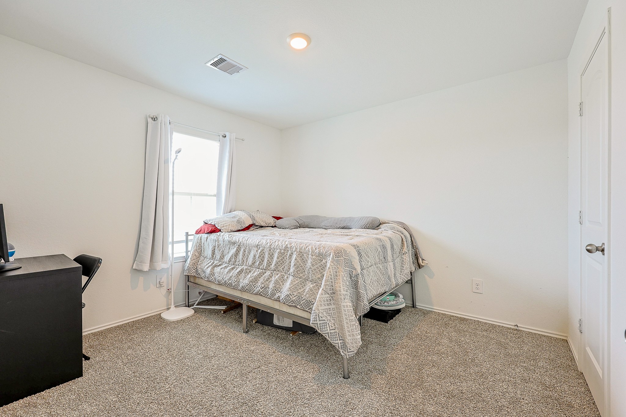 22603 Aspen Tarn Trail Spring, TX 77373 - Photo 17 of 20 a bed sitting in a room next to a window