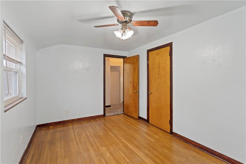 396 Hoffman Road Pittsburgh, PA 15212 - Photo 13 of 24 The second bedroom has the original hardwood floors!