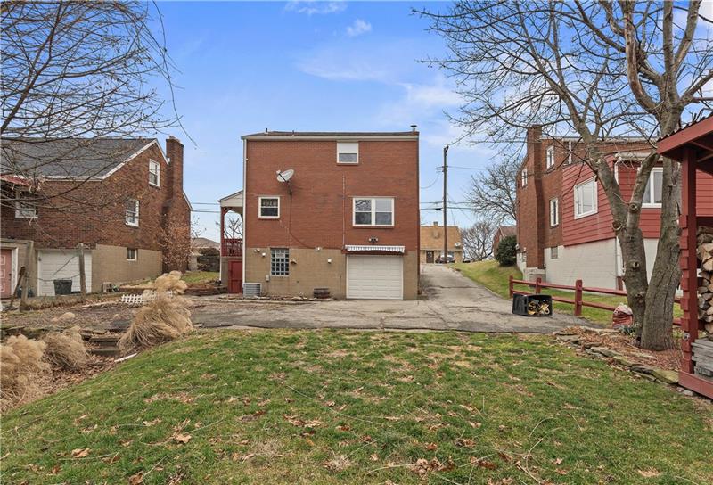 396 Hoffman Road Pittsburgh, PA 15212 - Photo 23 of 24 Plenty of room for all of your visitors! There is an area to the left of the garage that was used for a playground area. You already have a place for all of your wood for the fireplace!