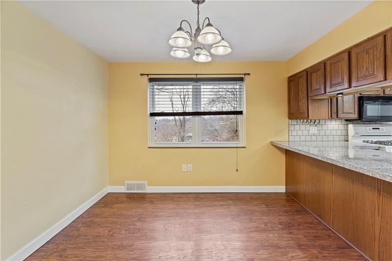396 Hoffman Road Pittsburgh, PA 15212 - Photo 7 of 24 Formal dining room that is also open concept to kitchen! Plenty of room for some bar stools if you desire! More natural light from the newer windows.