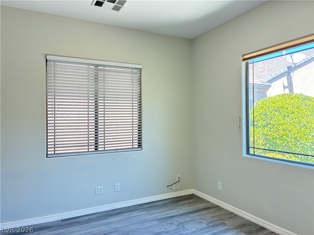 10 Caprington Road Henderson, NV 89052 - Photo 41 of 44 Vinyl plank flooring and ample natural light define this cozy bedroom.