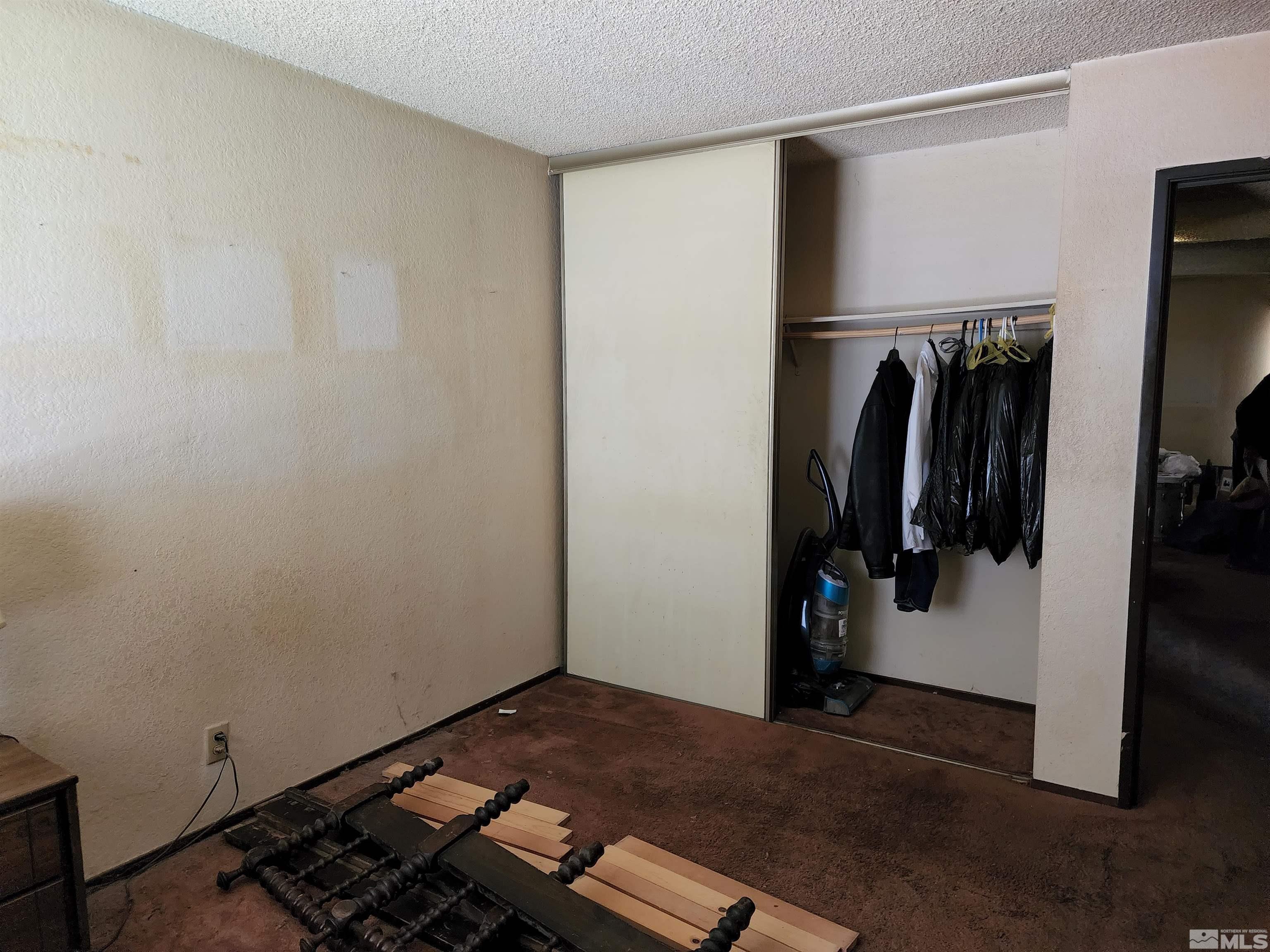 4600 Neil Road, Unit 9 Reno, NV 89502 - Photo 11 of 21 a view of walk in closet with clothes and shoes