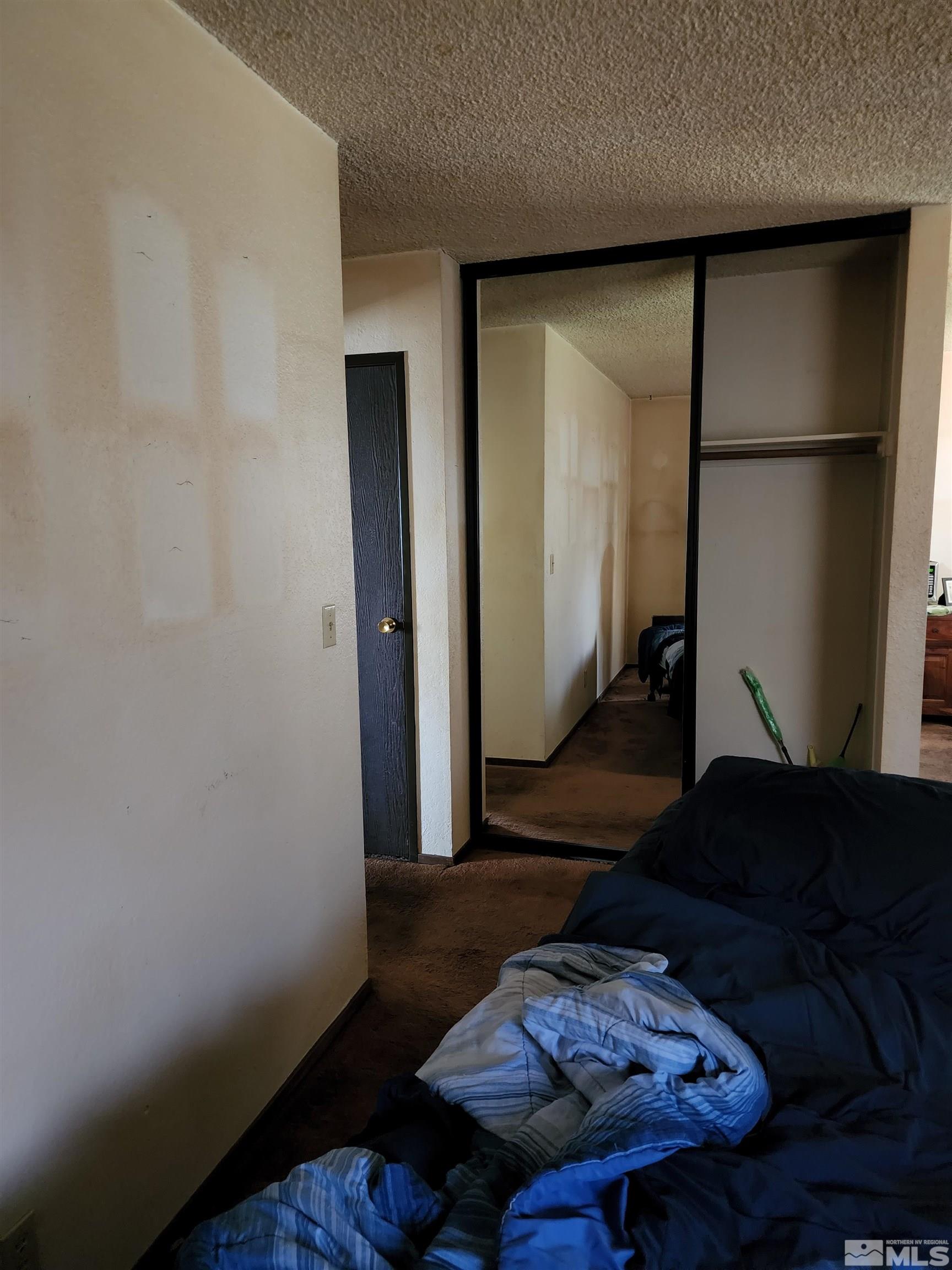 4600 Neil Road, Unit 9 Reno, NV 89502 - Photo 18 of 21 a living room with furniture and wooden floor