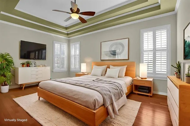 en empty room with windows and ceiling fan