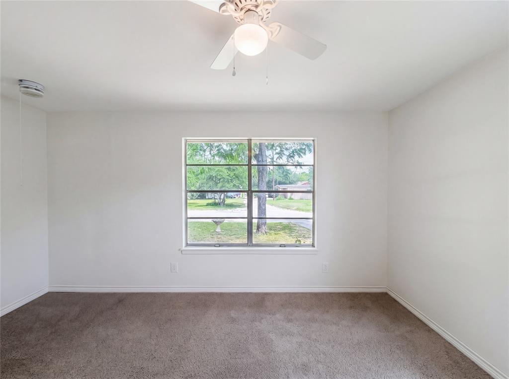 205 West Decatur Street Chico, TX 76431 - Photo 12 of 19 an empty room with a window