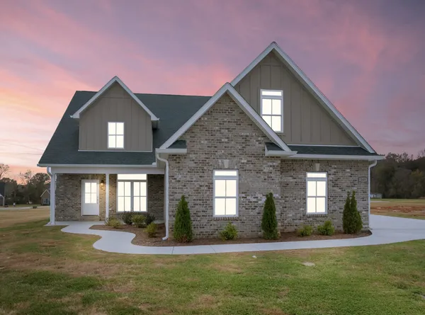 a front view of a house with a yard