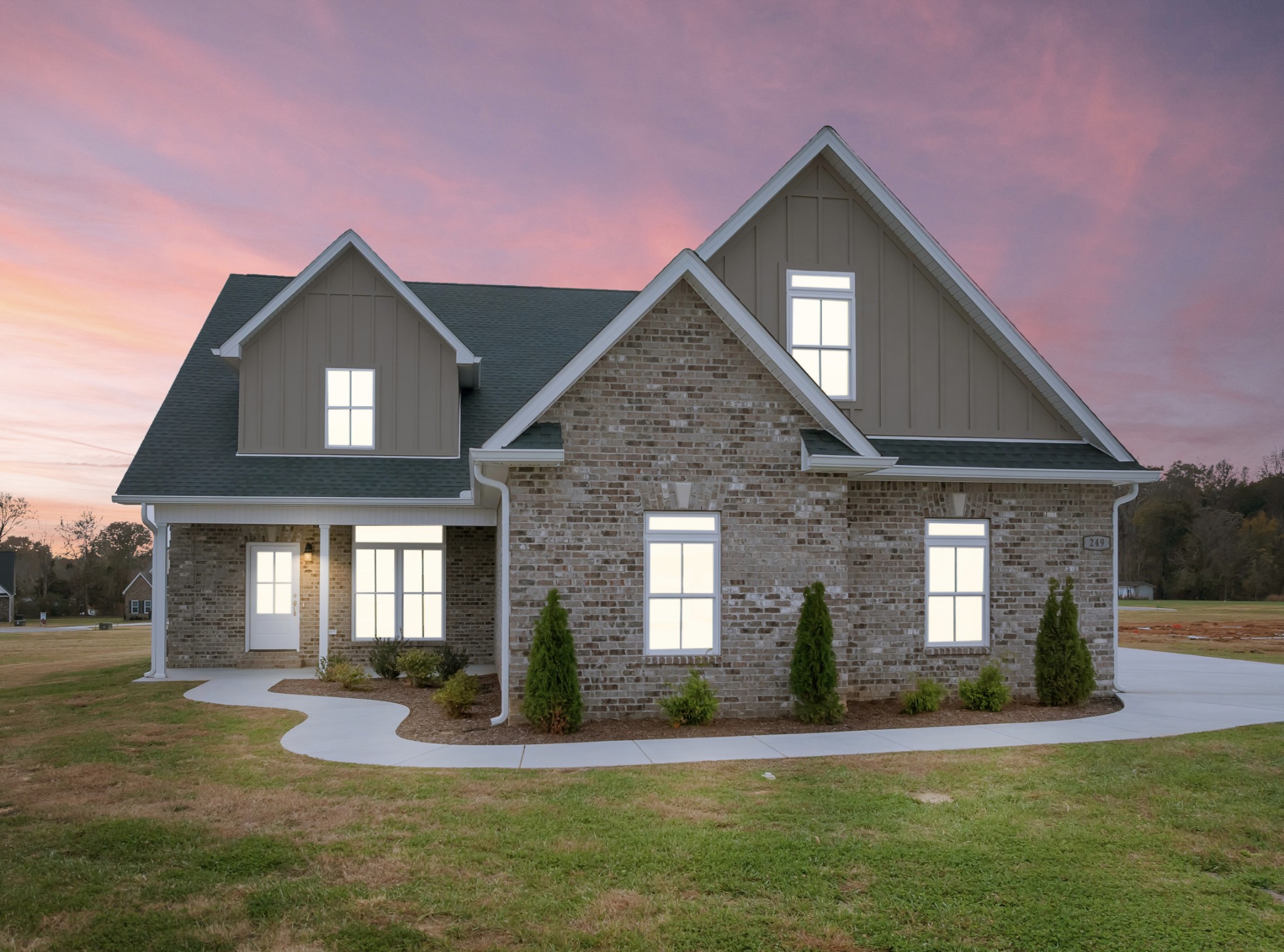 a front view of a house with a yard