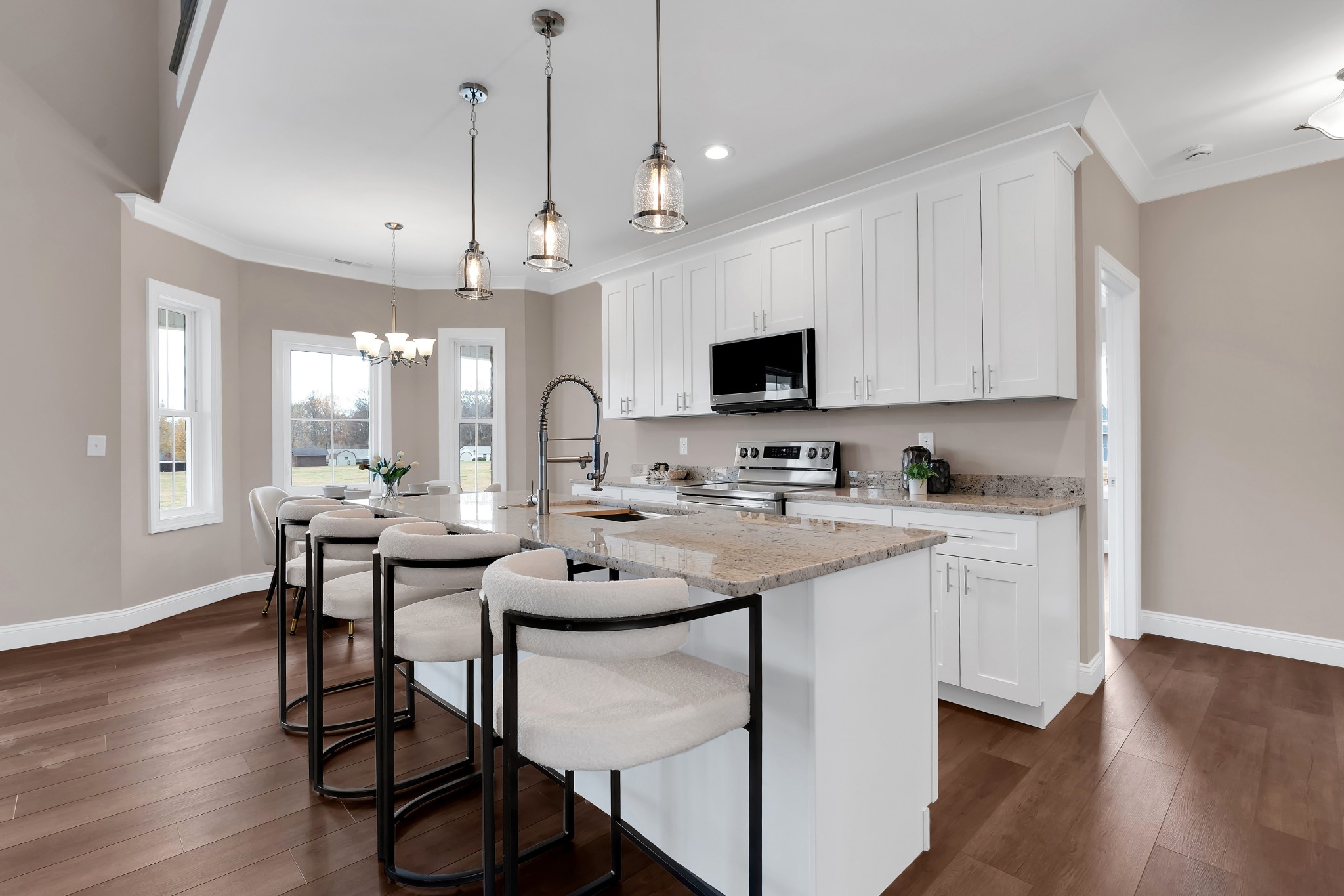 249 Lookout Drive Winchester, TN 37398 - Photo 15 of 63 a kitchen with stainless steel appliances kitchen island granite countertop a white table and chairs in it