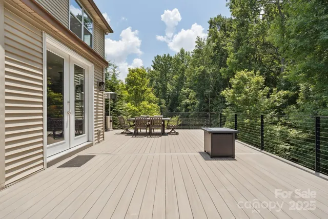 a large white kitchen with a stove and sink