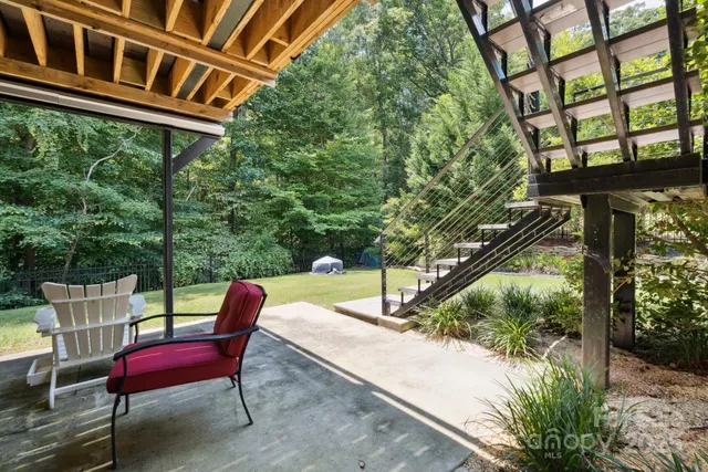 a view of a patio with a table and chairs