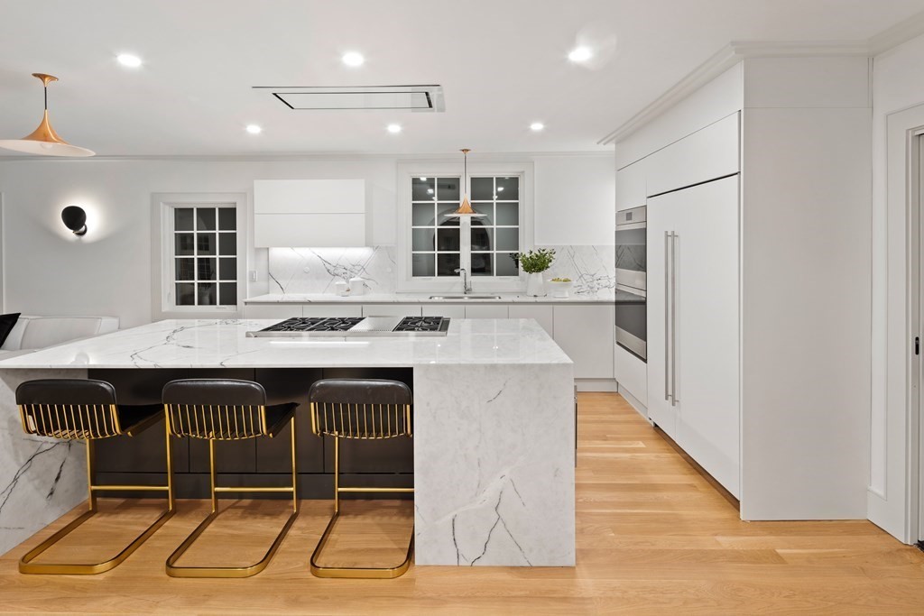 85 Willard Road Brookline, MA 02445 - Photo 15 of 29 a kitchen with stainless steel appliances granite countertop a stove and a refrigerator