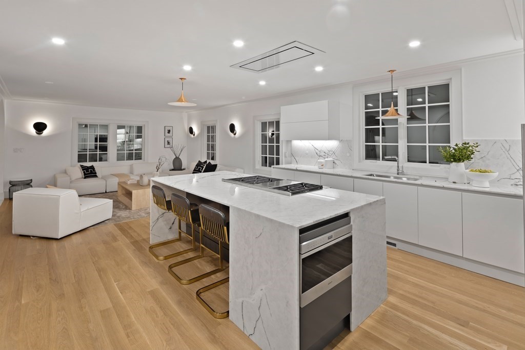 85 Willard Road Brookline, MA 02445 - Photo 16 of 29 a kitchen with a sink appliances and wooden cabinets