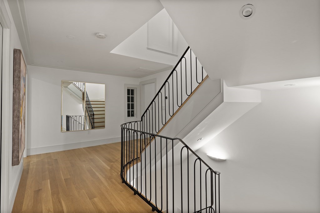 85 Willard Road Brookline, MA 02445 - Photo 25 of 29 a view of staircase with railing and white walls