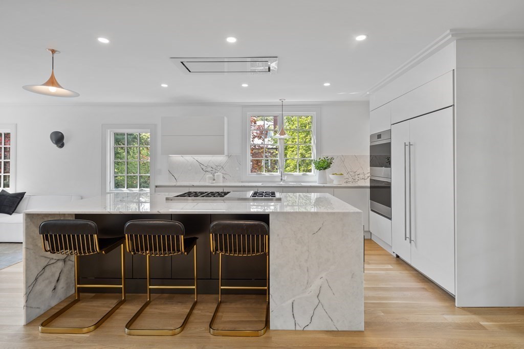 85 Willard Road Brookline, MA 02445 - Photo 5 of 29 a kitchen with stainless steel appliances granite countertop a sink and a refrigerator