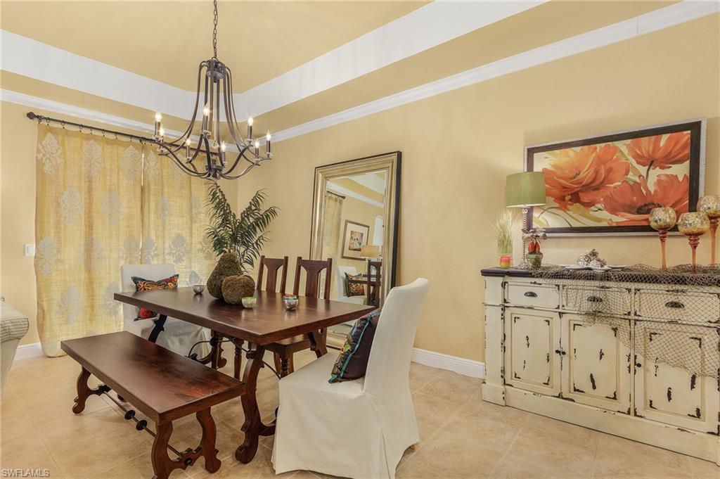 9803 Bodego Way, Unit 104 Fort Myers, FL 33908 - Photo 12 of 31 a dining room with furniture and window