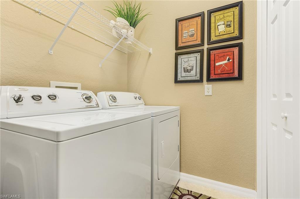 9803 Bodego Way, Unit 104 Fort Myers, FL 33908 - Photo 27 of 31 a utility room with dryer and washer