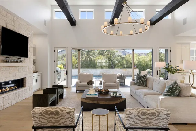 a living room with furniture fireplace and a flat screen tv