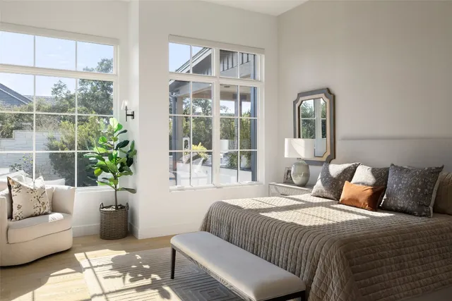 a bathroom with a bathtub sink and mirror
