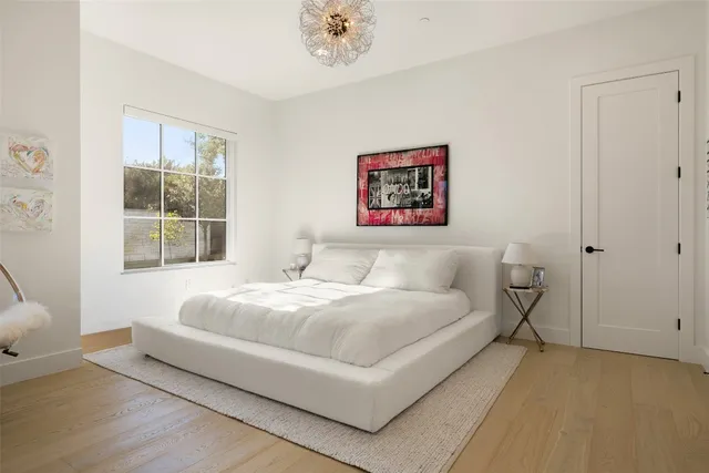 a bedroom with a bed and window