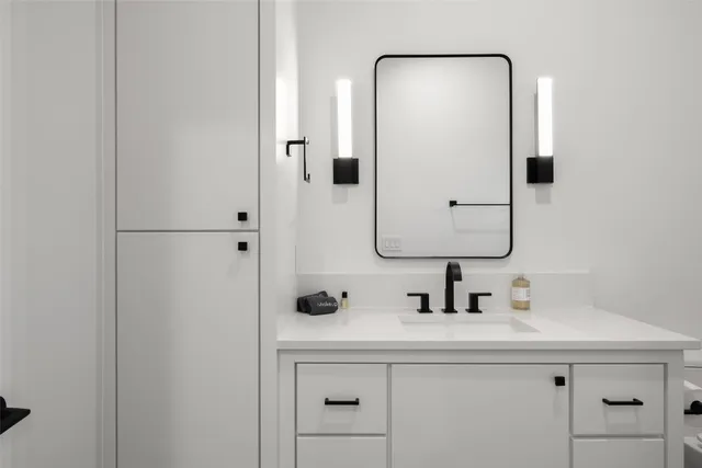 a bathroom with a sink and a mirror