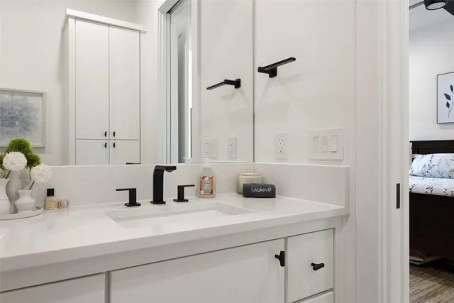 a bathroom with a sink and a mirror