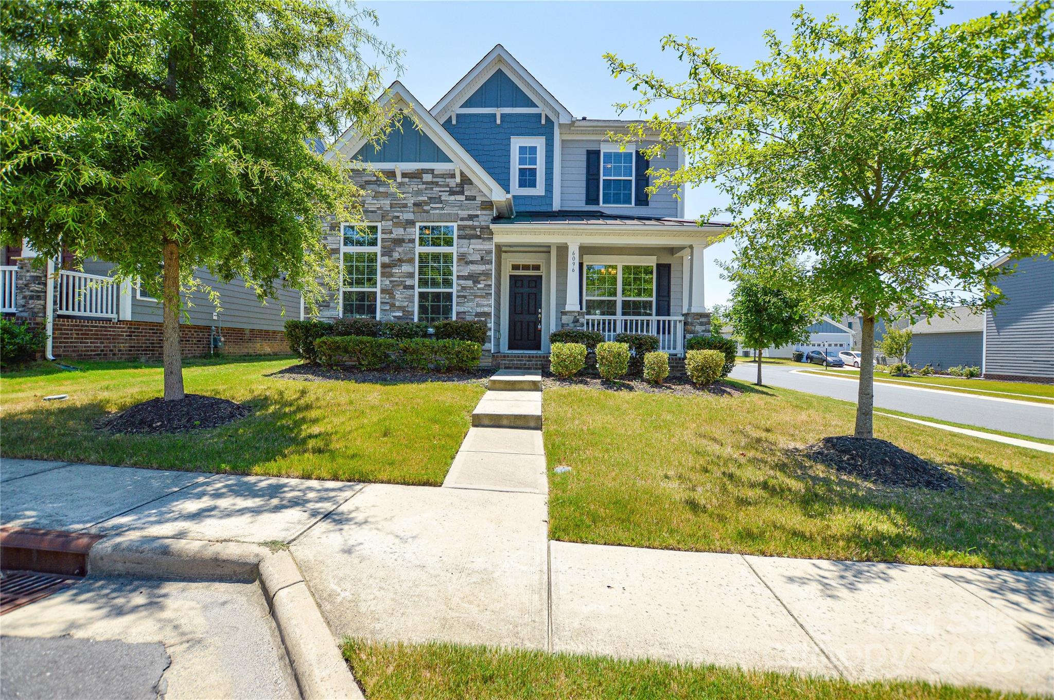 6096 Cloverdale Drive Fort Mill, SC 29708 - Photo 1 of 48 a front view of a house with a yard