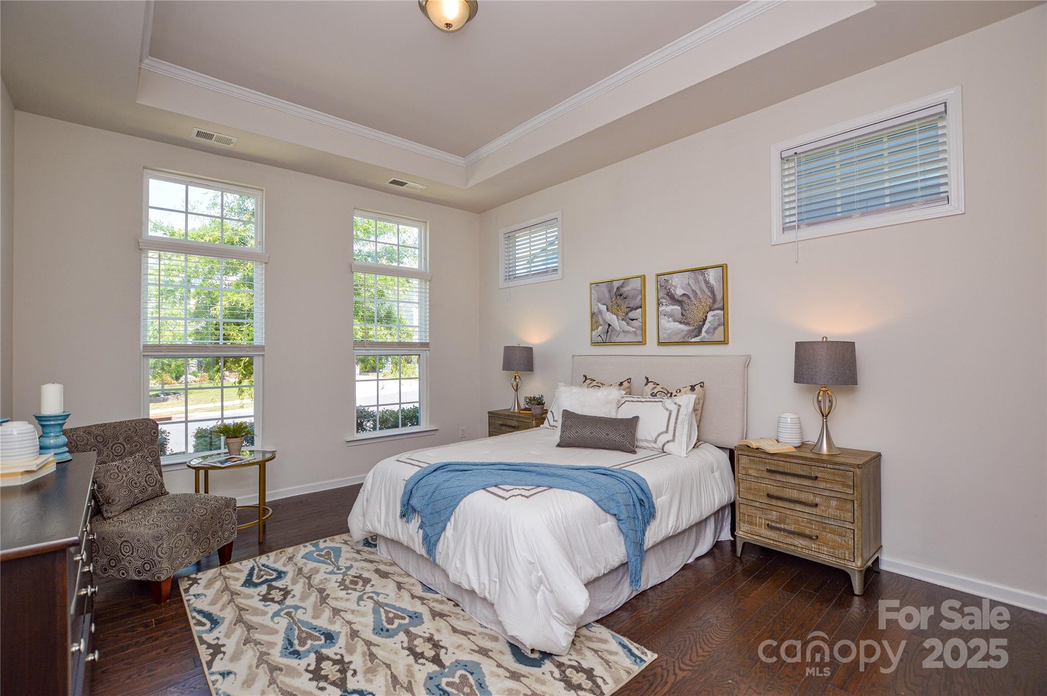 6096 Cloverdale Drive Fort Mill, SC 29708 - Photo 20 of 48 a bedroom with a bed and wooden floor
