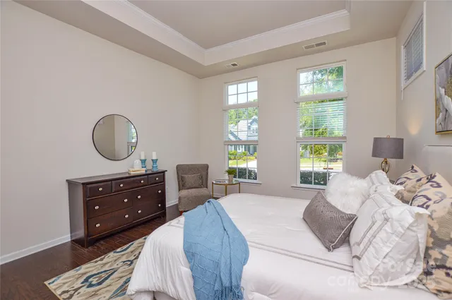 a bed room with a bed and a dresser