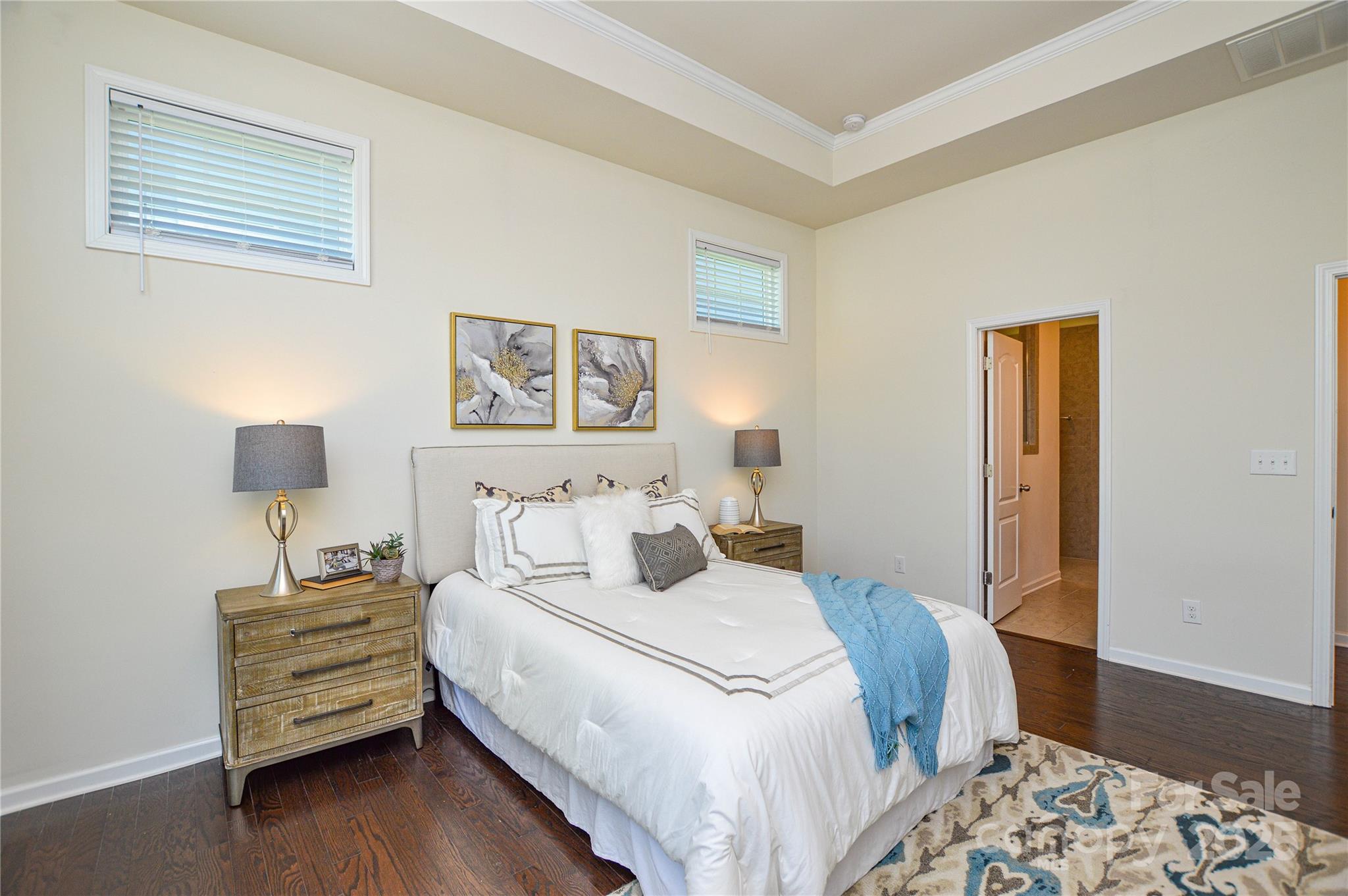 6096 Cloverdale Drive Fort Mill, SC 29708 - Photo 22 of 48 a bedroom with a bed and a wooden floor