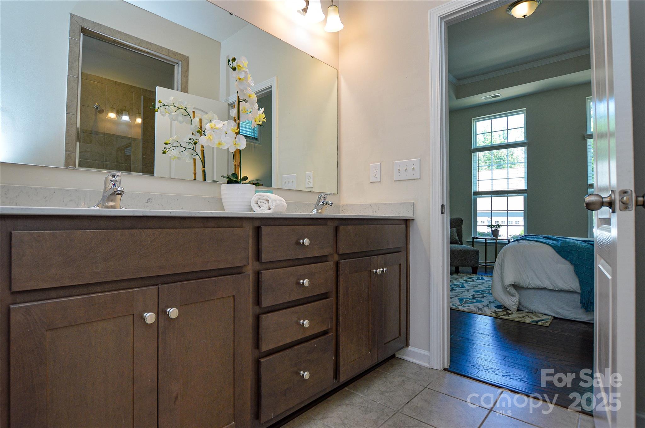 6096 Cloverdale Drive Fort Mill, SC 29708 - Photo 24 of 48 a en suite bathroom with a sink double vanity granite and a mirror