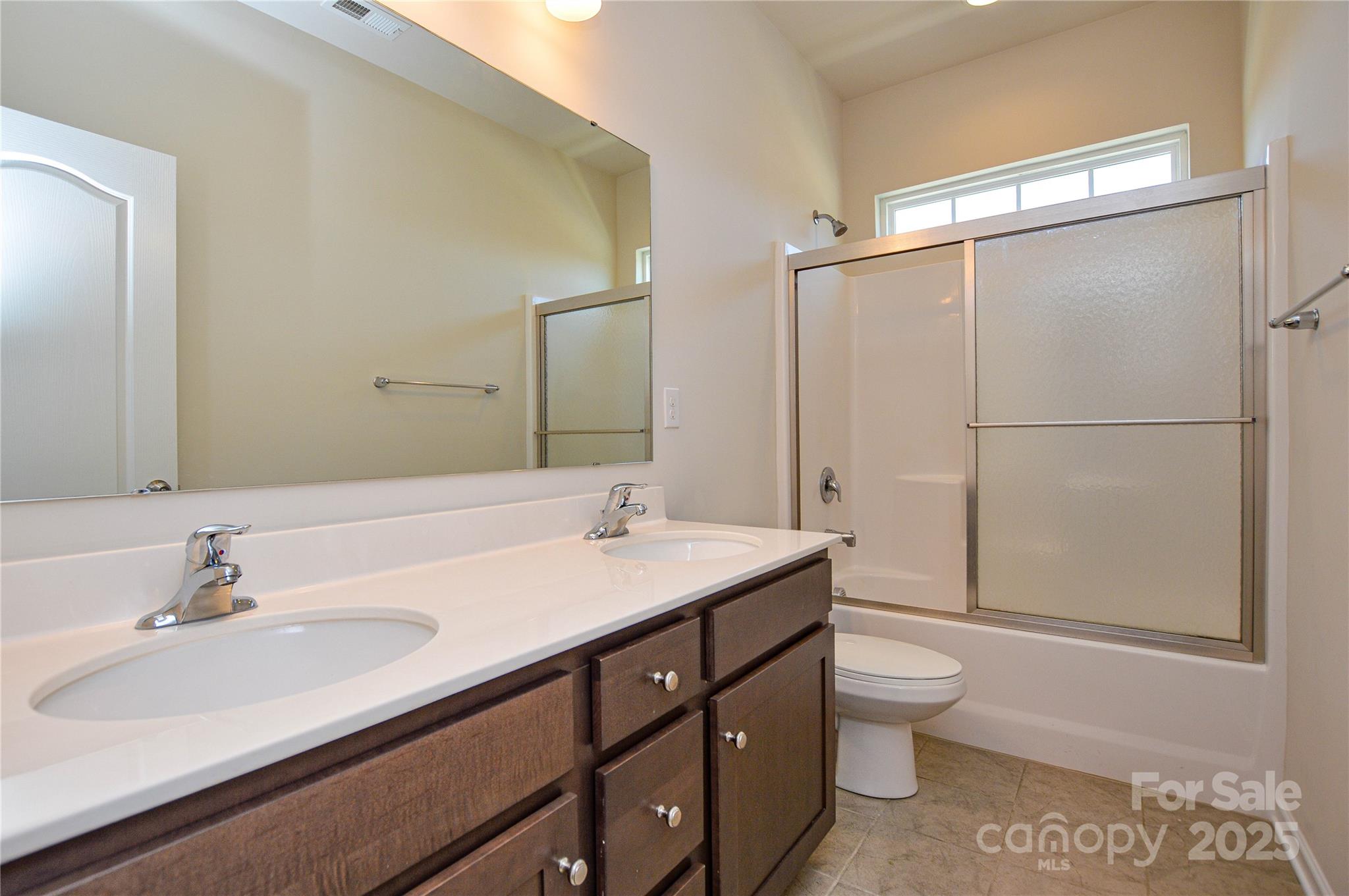 6096 Cloverdale Drive Fort Mill, SC 29708 - Photo 32 of 48 a bathroom with a sink toilet and shower