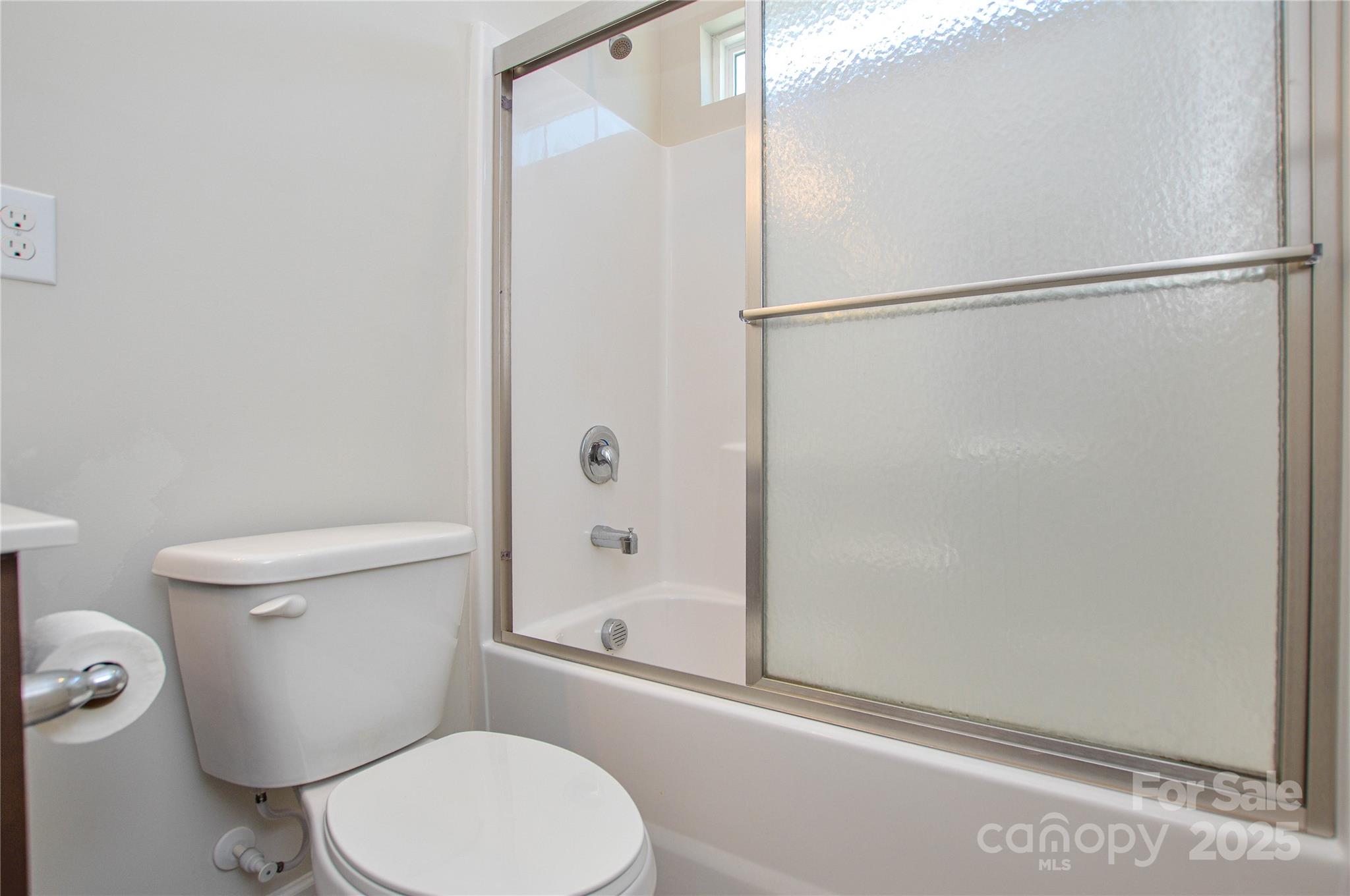 6096 Cloverdale Drive Fort Mill, SC 29708 - Photo 34 of 48 a white toilet sitting next to a shower