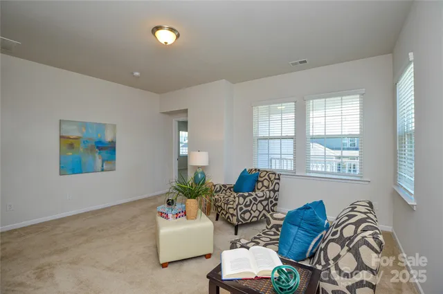a living room with furniture and window