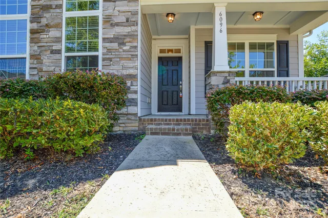 a view of a pathway front of house