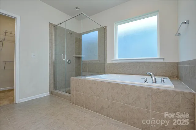 a bathroom with a bathtub and a sink