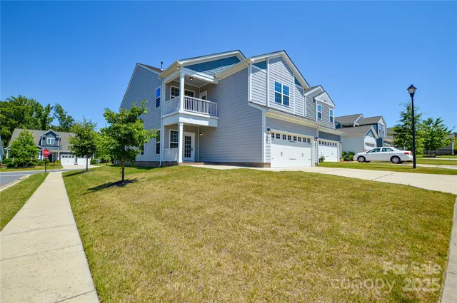 a swimming pool with buildings in the background