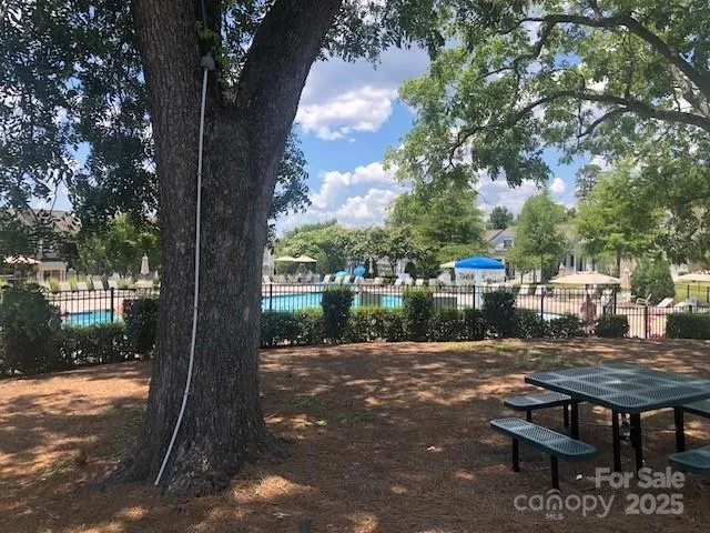 a wooden bench sitting in front of a building