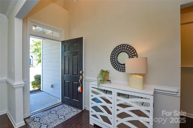 a view of bedroom with furniture and a window