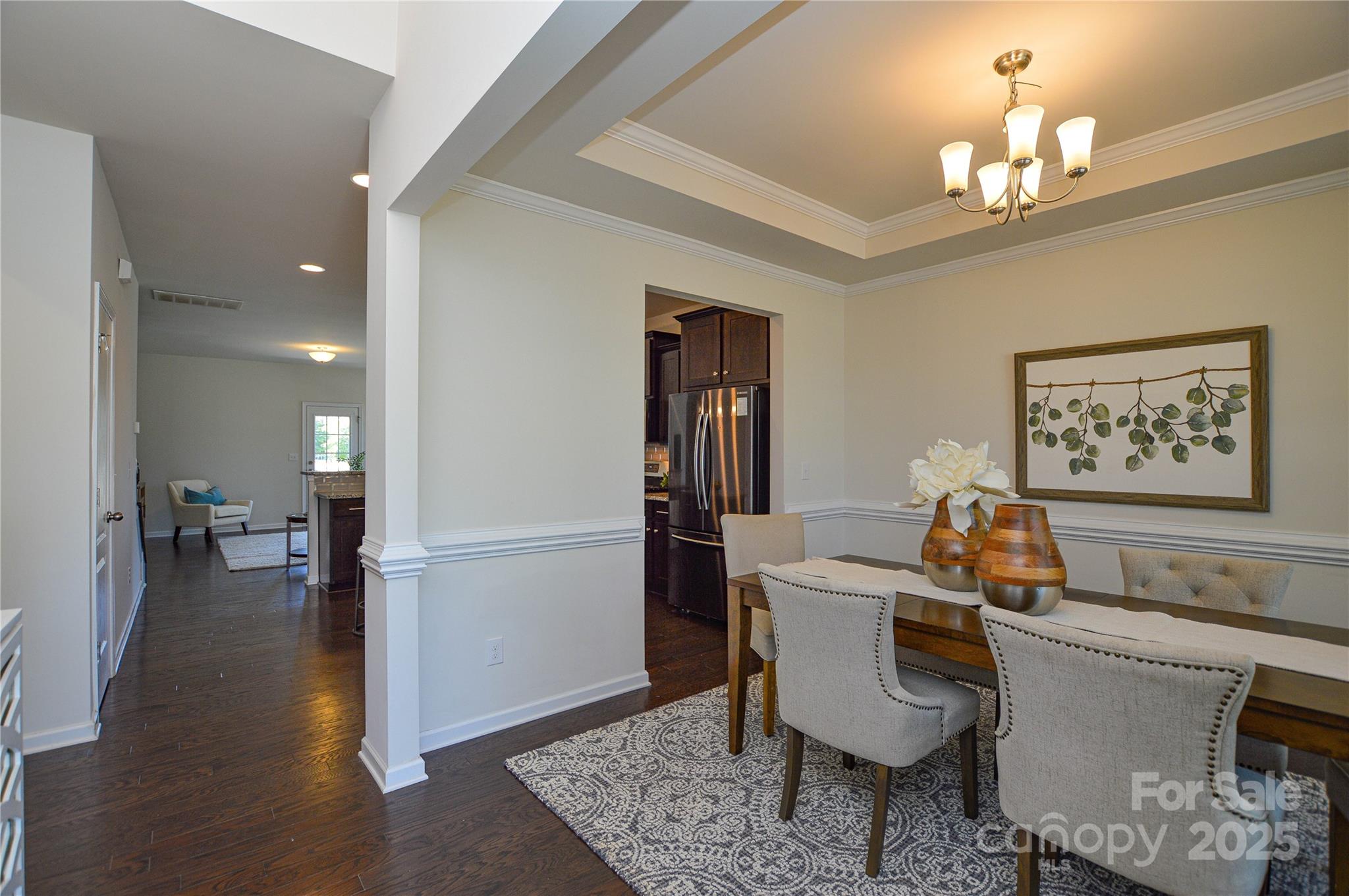 6096 Cloverdale Drive Fort Mill, SC 29708 - Photo 10 of 48 a view of a dining room with furniture wooden floor and a chandelier