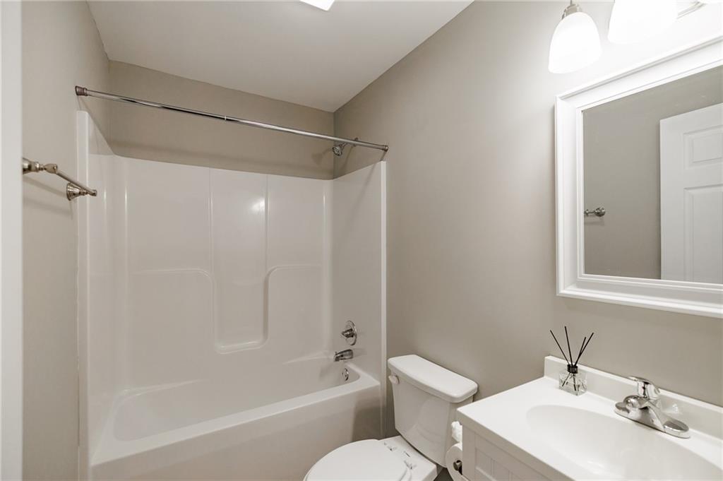 103 Three Rivers Court Hull, GA 30646 - Photo 35 of 40 a bathroom with a bathtub shower sink vanity and toilet