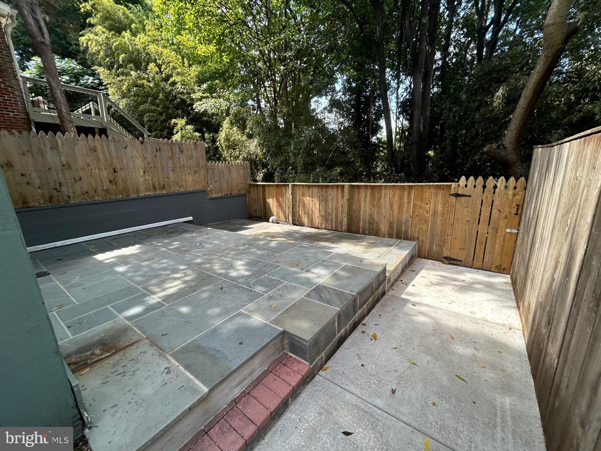 2036 Tunlaw Road Northwest Washington, DC 20007 - Photo 16 of 19 Fenced Flagstone Patio