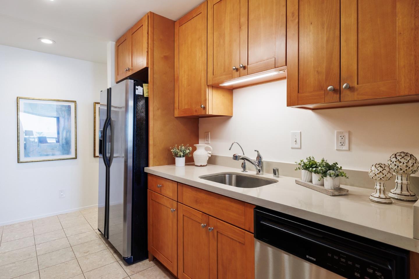 360 Vallejo Drive, Unit 113 Millbrae, CA 94030 - Photo 13 of 34 a kitchen with stainless steel appliances sink refrigerator and cabinets