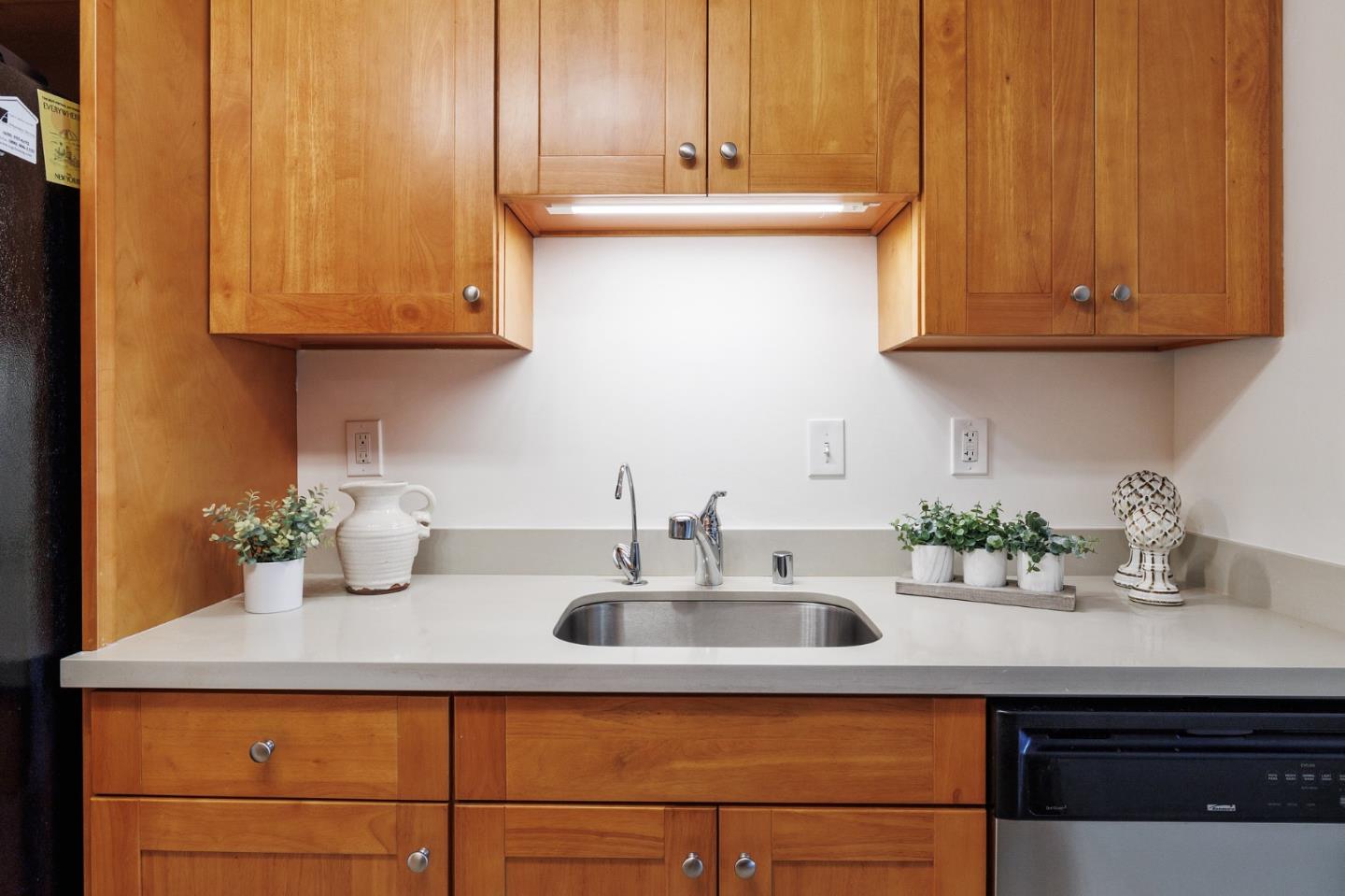 360 Vallejo Drive, Unit 113 Millbrae, CA 94030 - Photo 14 of 34 a kitchen with stainless steel appliances granite countertop a sink and cabinets