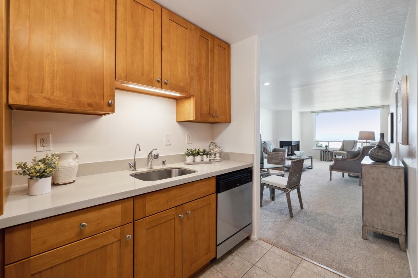 360 Vallejo Drive, Unit 113 Millbrae, CA 94030 - Photo 15 of 34 a kitchen with a sink and cabinets
